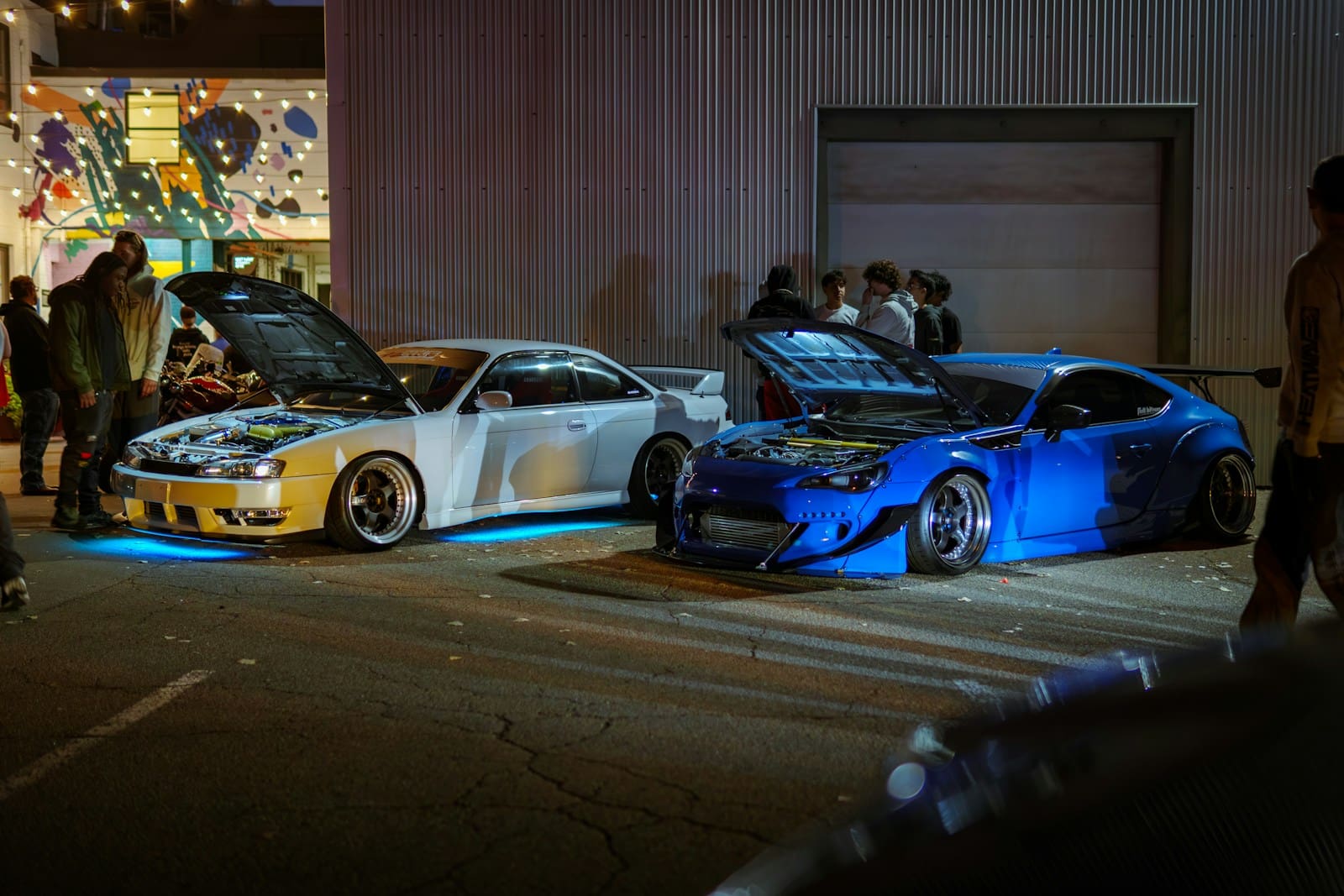 A group of cars parked next to each other in a parking lot